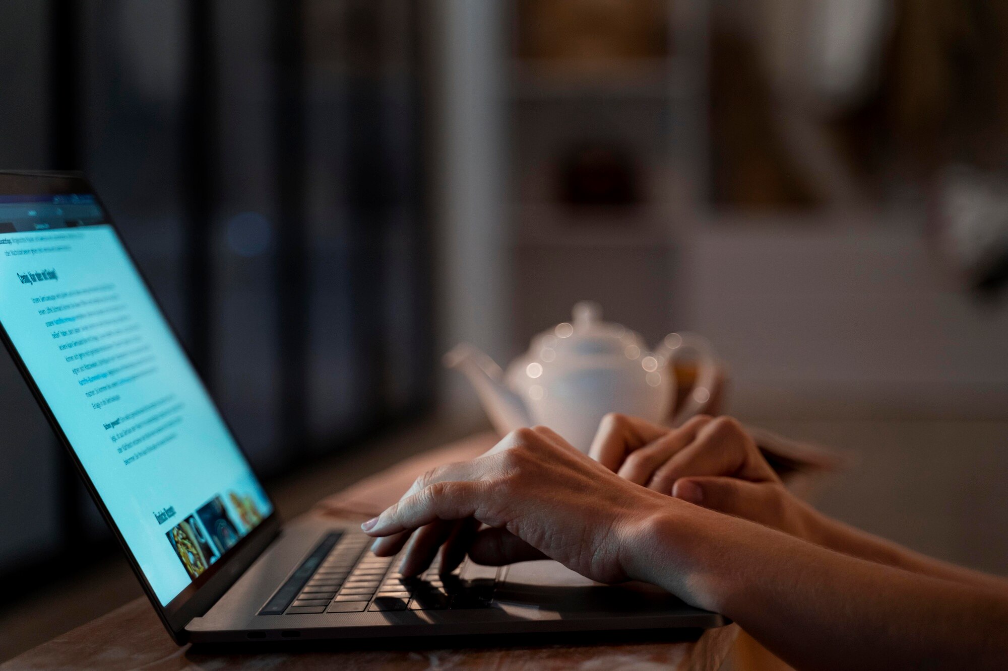 woman typing on a laptop